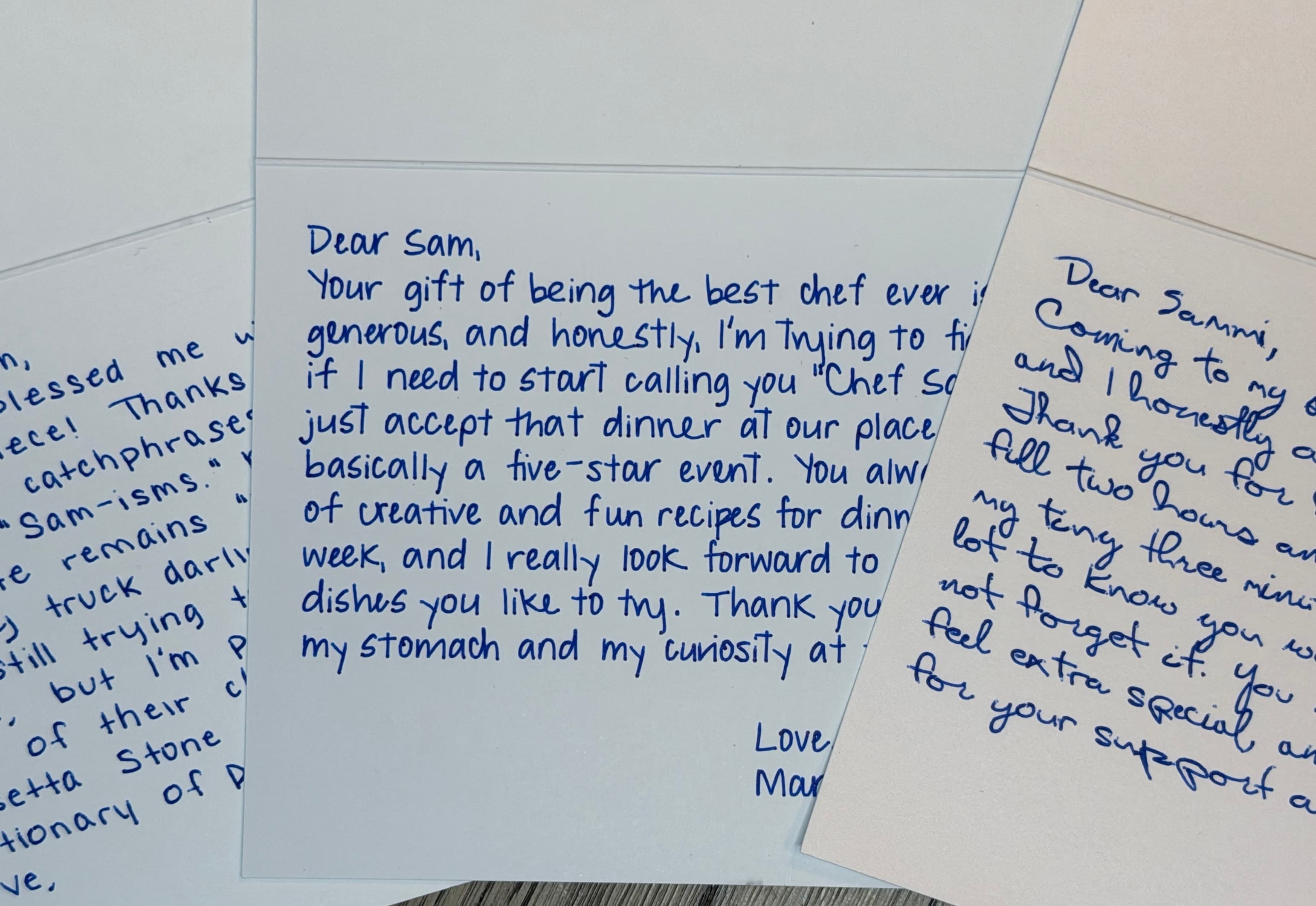Three real thank you notes on white card stock with blue ink